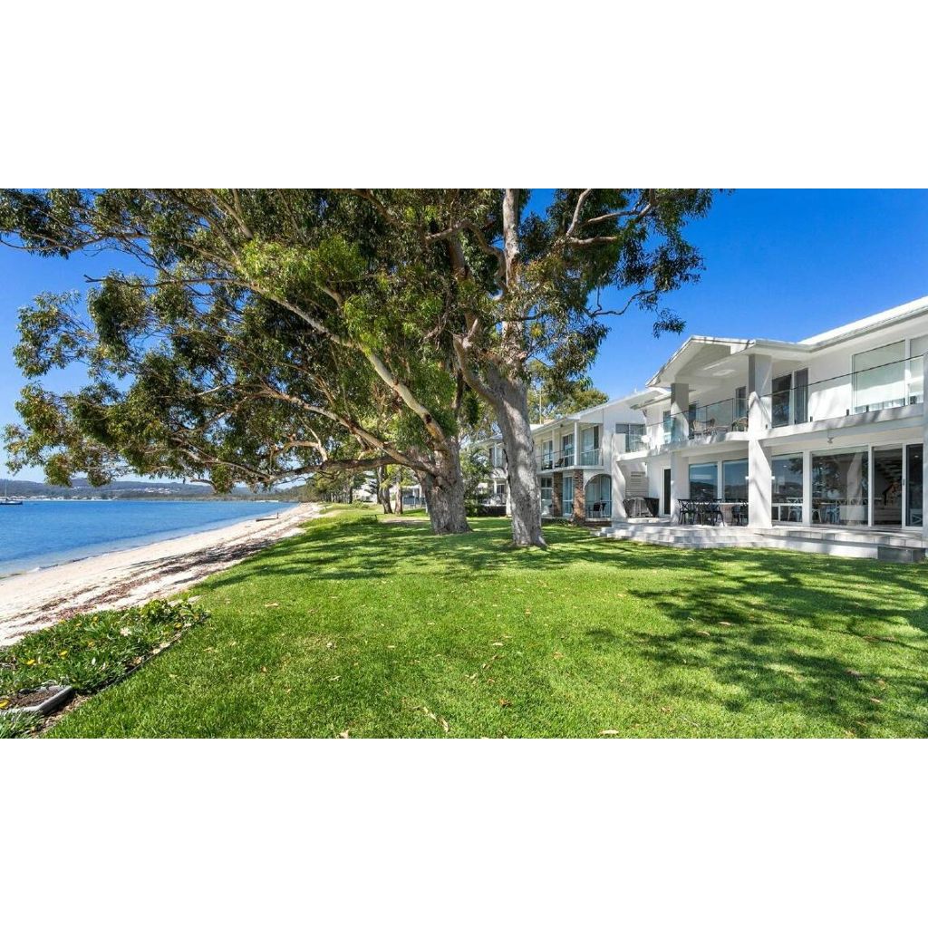 Millionaire row three homes on Salamander Bay waterfront strip pull in
