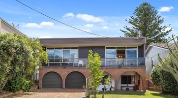 Groovy 1960s time capsule with carpeted walls and retro bar listed in Redhead